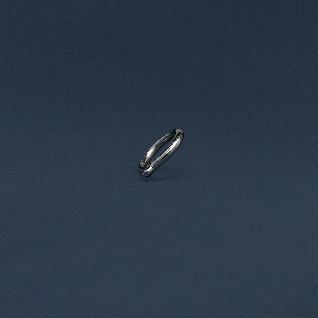 Small metallic object on a dark blue background